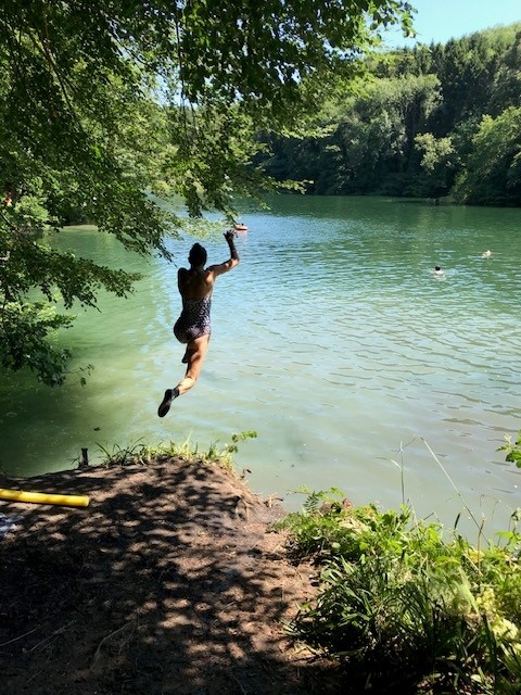 Picture of woman jumping in a lake